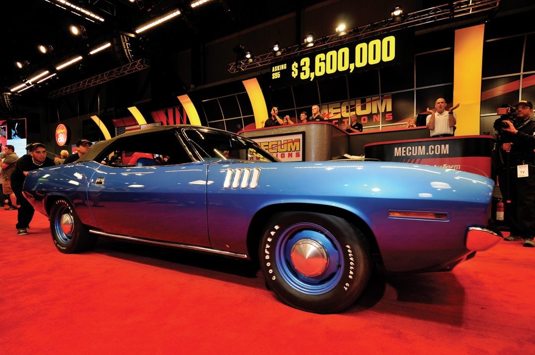A 1971 Plymouth Hemi Cuda on the Mecum Auctions floor, bidding at $3,600,000 — a testament to the enduring value of these cars