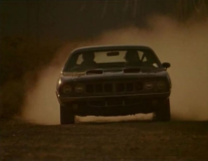 Phantasm Cuda charging through a dust cloud — front-on production still