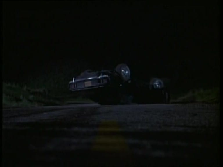 Phantasm II Cuda crash scene — the stunt car rolled on a dark rural road. One of the most dramatic sequences in the film.