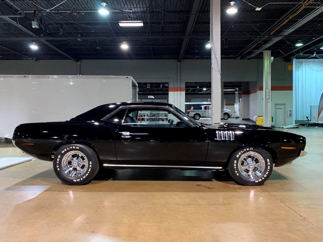 Side Show Profile — sinister black, correct Bulge hood with HemiCuda callouts, period correct wheels and ultra rare Remington correct coded tires used on the original movie car.