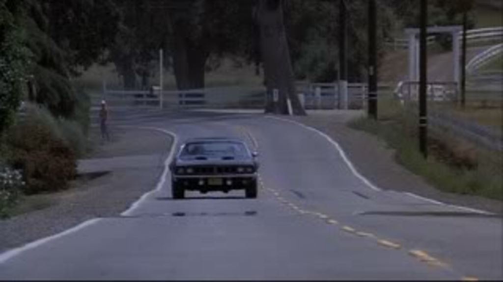Phantasm Cuda driving a rural road — production location still