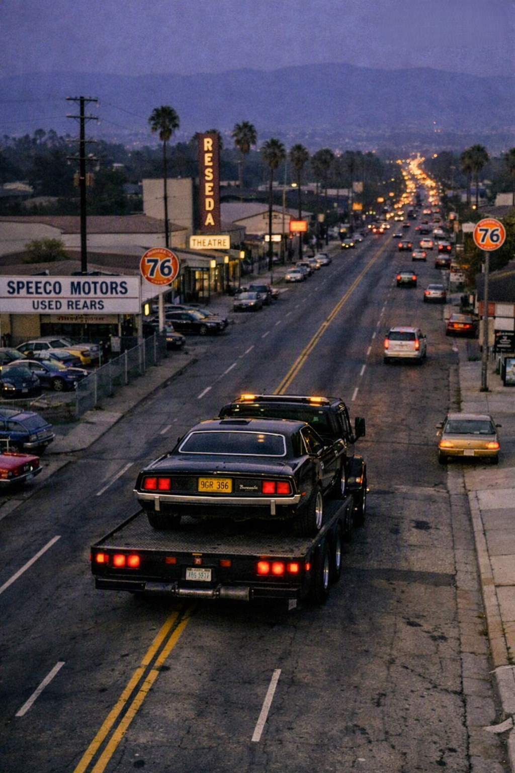 A black muscle car on a flatbed truck heading up Reseda Boulevard at dusk — the Cuda leaving the neighborhood for the last time