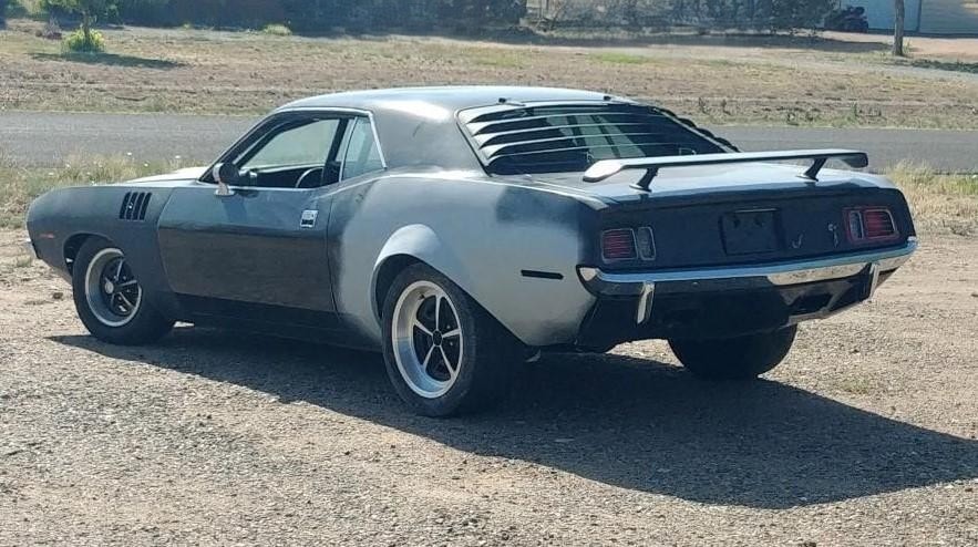 A reproduction attempt at the 1971 Movie Cuda flares — raw bodywork showing the difficulty of hand-sculpting the original profile