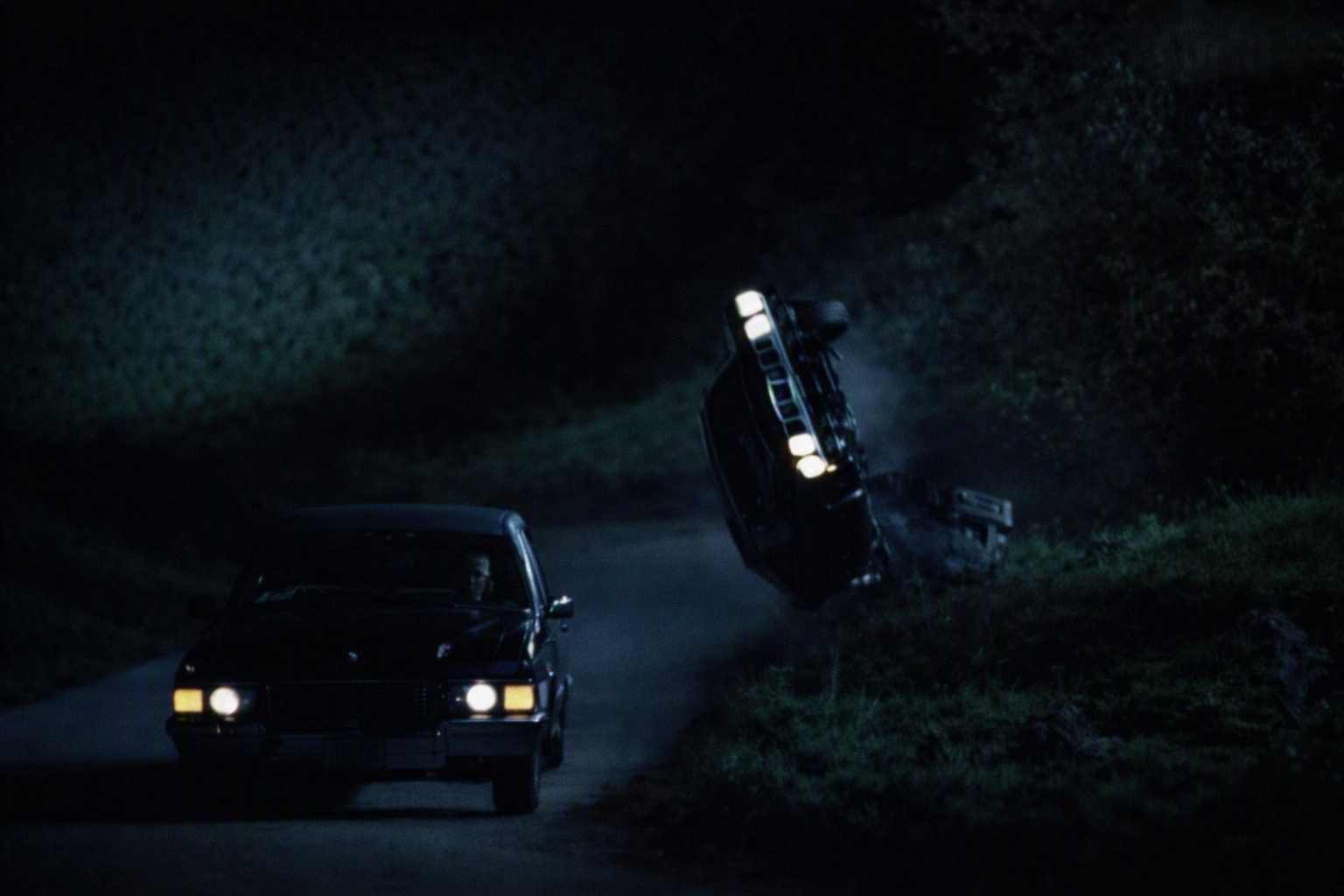 Phantasm II nighttime stunt scene — the Cuda flipping on a dark road