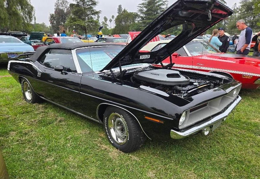 Black Phantasm HemiCuda convertible displayed with its hood open at Woodley Park